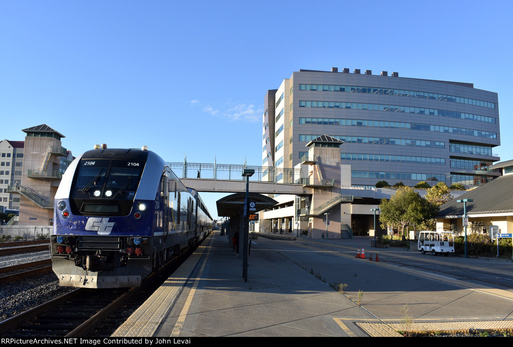 Caltrans Charger # 2104 leads Amtrak Train # 545 into the depot. This train is running between Sacramento and Oakland Jack London Square.